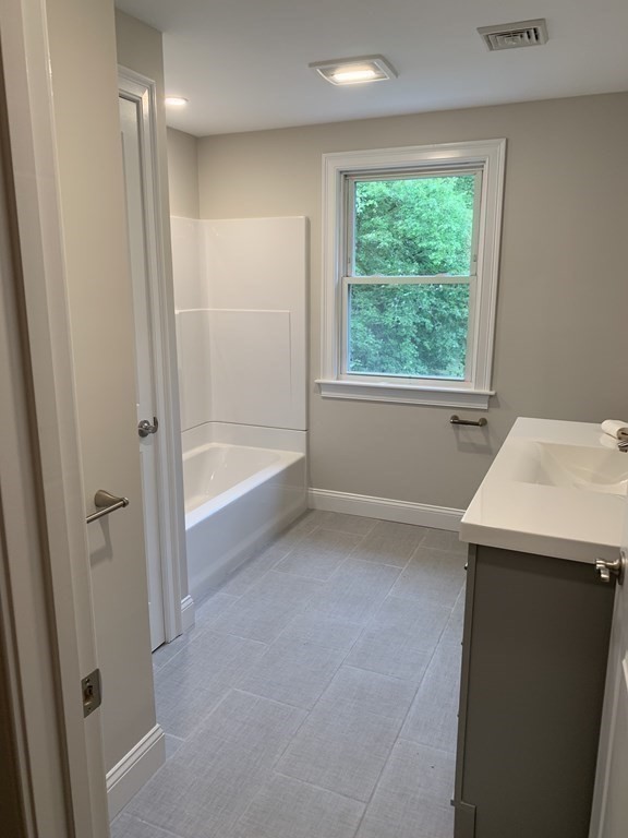 71 Narrows Road Freetown, MA 02702 - Photo 18 of 24 a bathroom with a sink and a bathtub