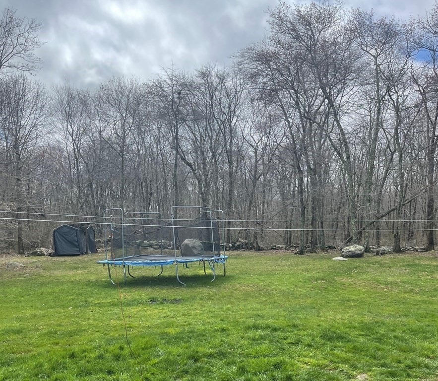 71 Narrows Road Freetown, MA 02702 - Photo 3 of 24 a view of a backyard with a slide