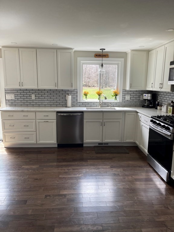 71 Narrows Road Freetown, MA 02702 - Photo 6 of 24 a kitchen with stainless steel appliances granite countertop a stove and cabinets