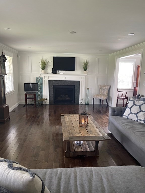 71 Narrows Road Freetown, MA 02702 - Photo 9 of 24 a living room with furniture and a fireplace