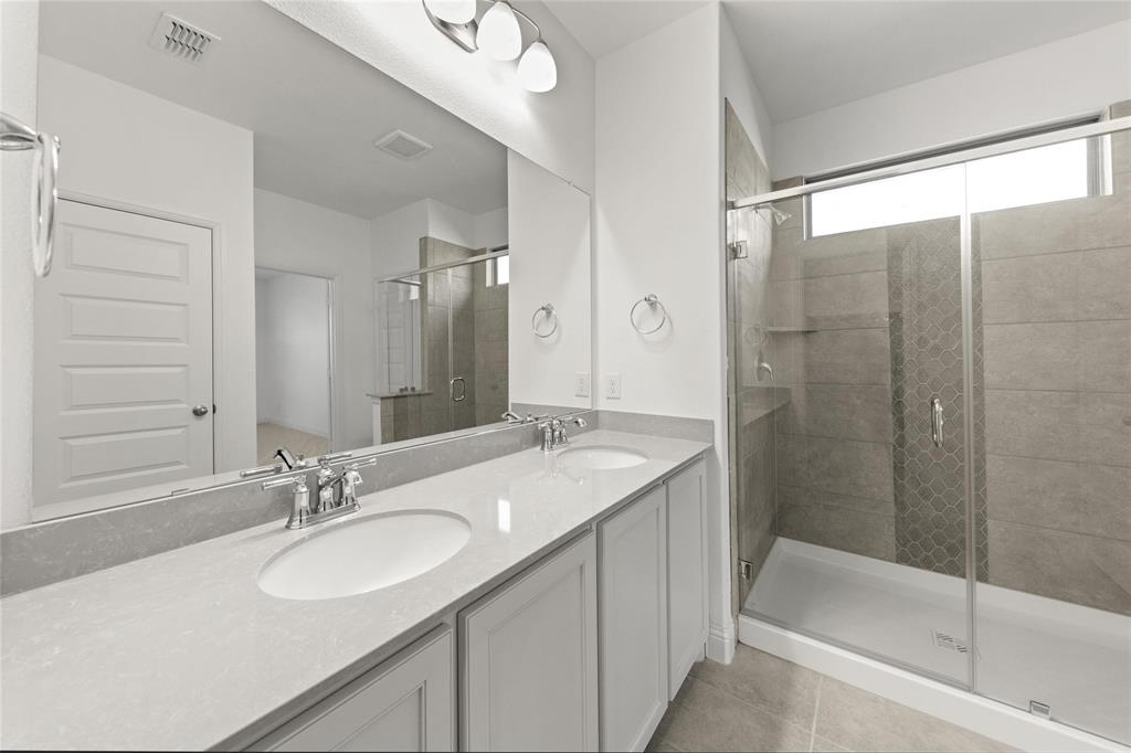 322 Boston Drive Princeton, TX 75407 - Photo 13 of 18 a bathroom with a sink and a mirror