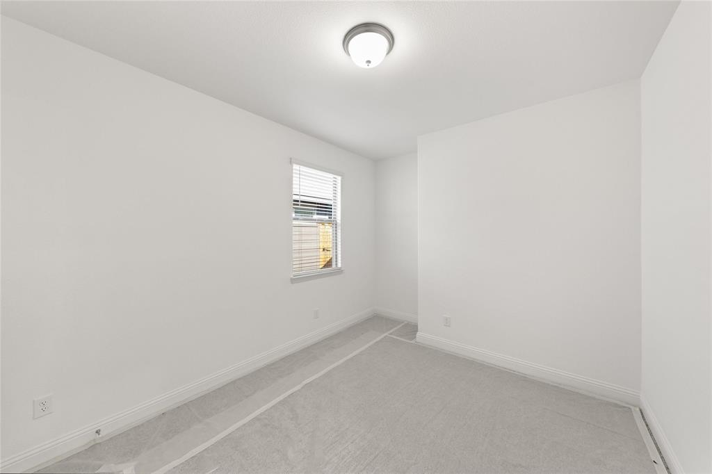 322 Boston Drive Princeton, TX 75407 - Photo 16 of 18 an empty room with a window