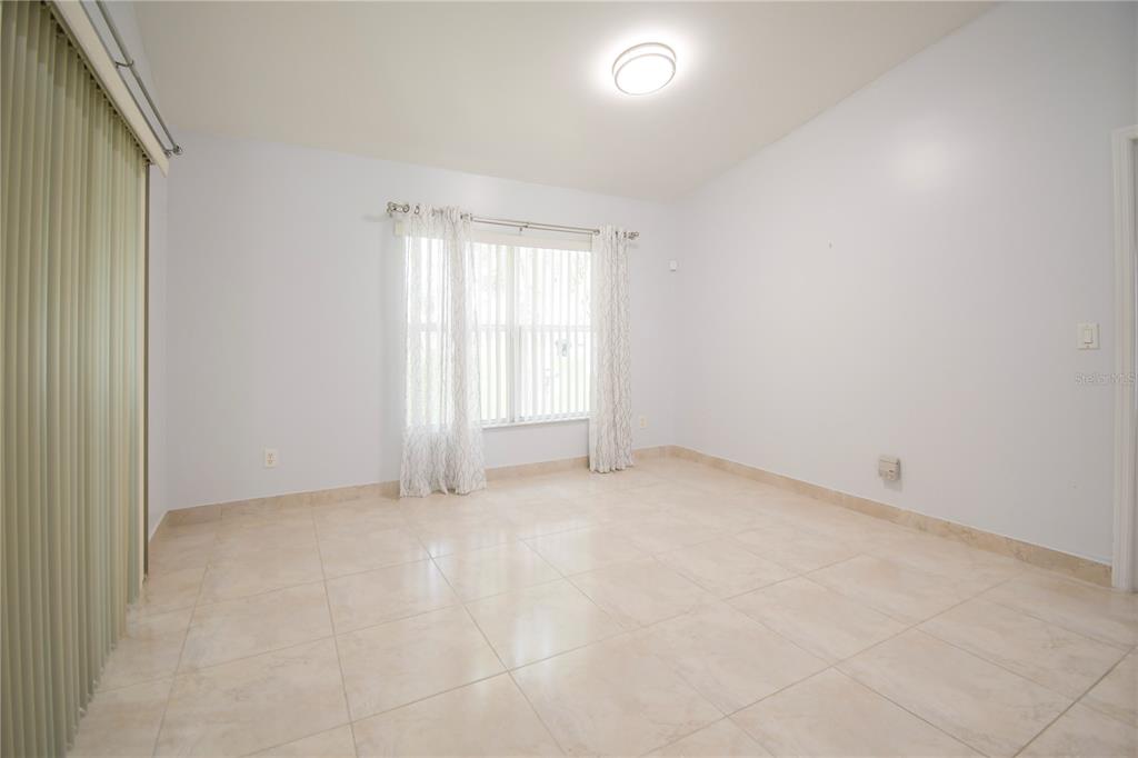 4913 Cromey Road North Port, FL 34288 - Photo 6 of 36 an empty room with windows