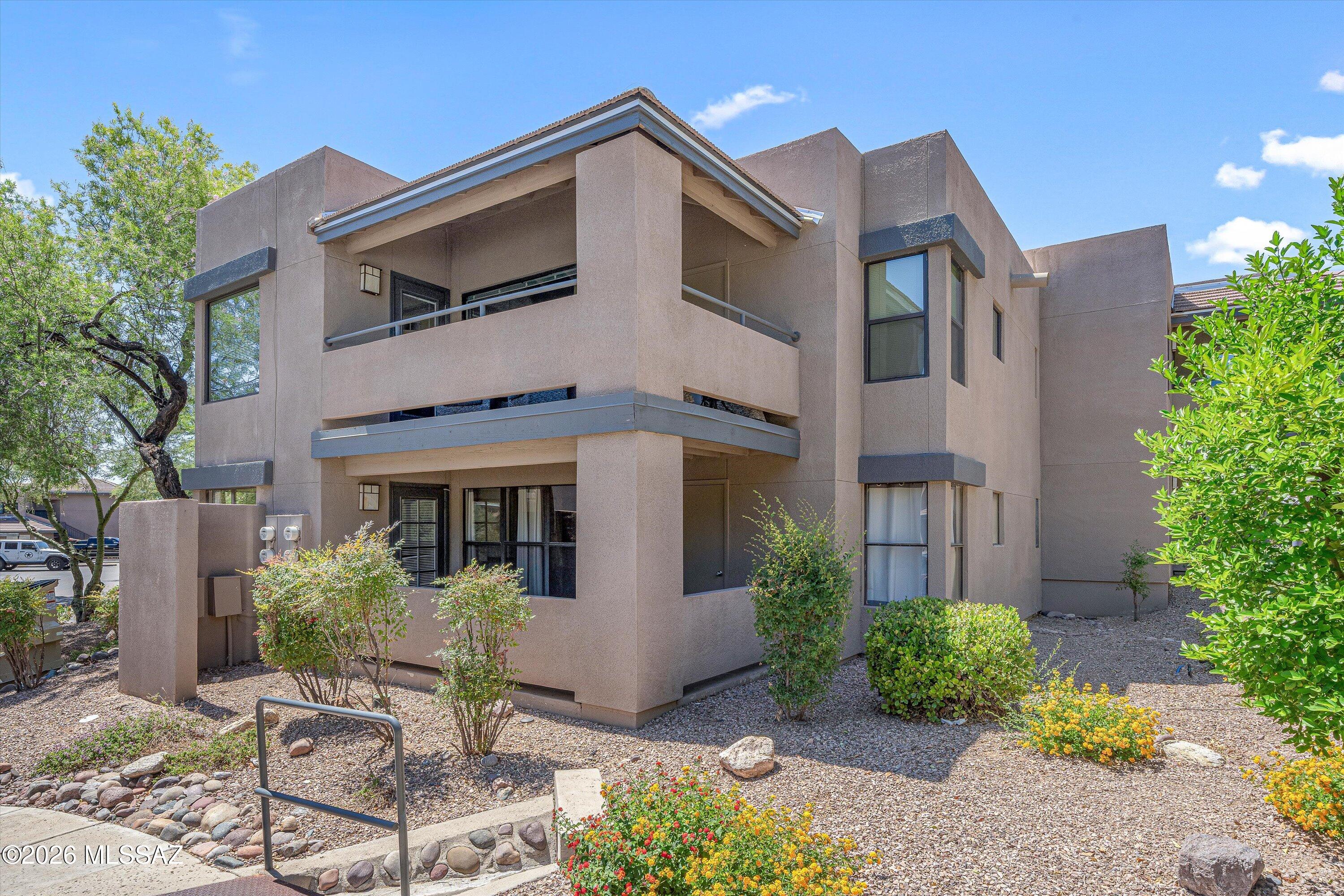 5855 North Kolb Road, Unit 8106 Tucson, AZ 85750 - Photo 25 of 34 a front view of a house with garden