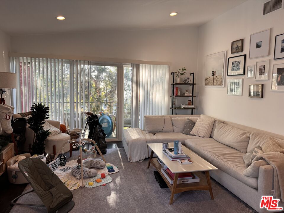 2639 6th Street Santa Monica, CA 90405 - Photo 1 of 22 a living room with furniture a couch and a large window