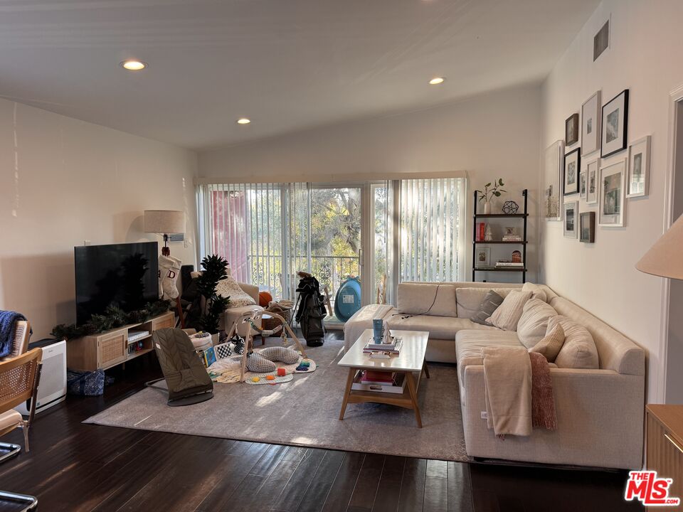 2639 6th Street Santa Monica, CA 90405 - Photo 2 of 22 a living room with furniture and a flat screen tv
