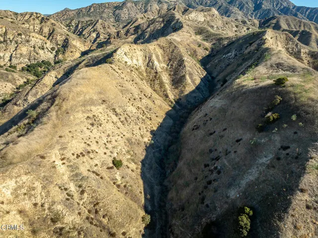 a view of mountain view with mountains in the background