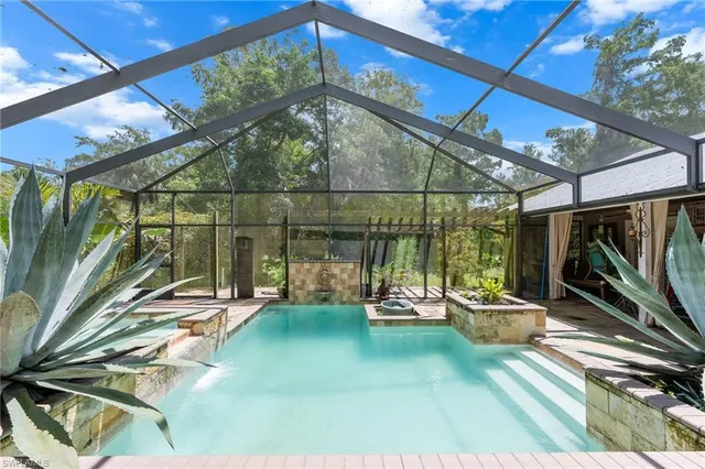 a view of a swimming pool with a patio