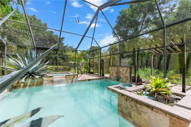 a view of swimming pool with a patio and a yard