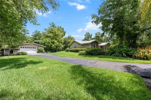 a view of a house with a big yard