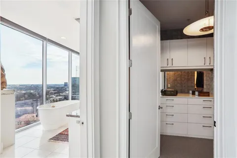 a kitchen with a window and a view of living room