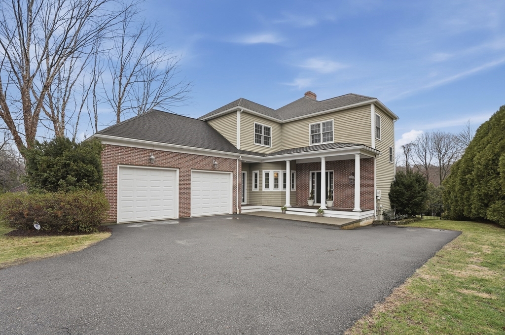 531 Salisbury Street Worcester, MA 01609 - Photo 1 of 42 a front view of a house with a yard and garage