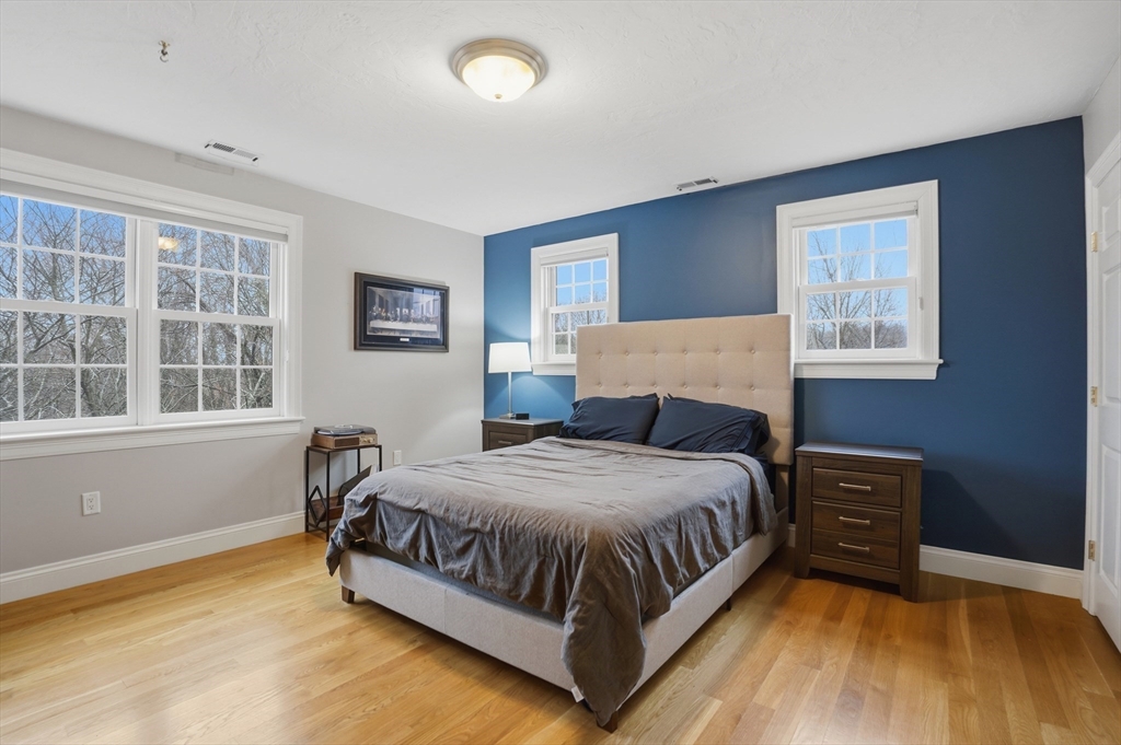 531 Salisbury Street Worcester, MA 01609 - Photo 27 of 42 a bedroom with a bed lamp closet and window