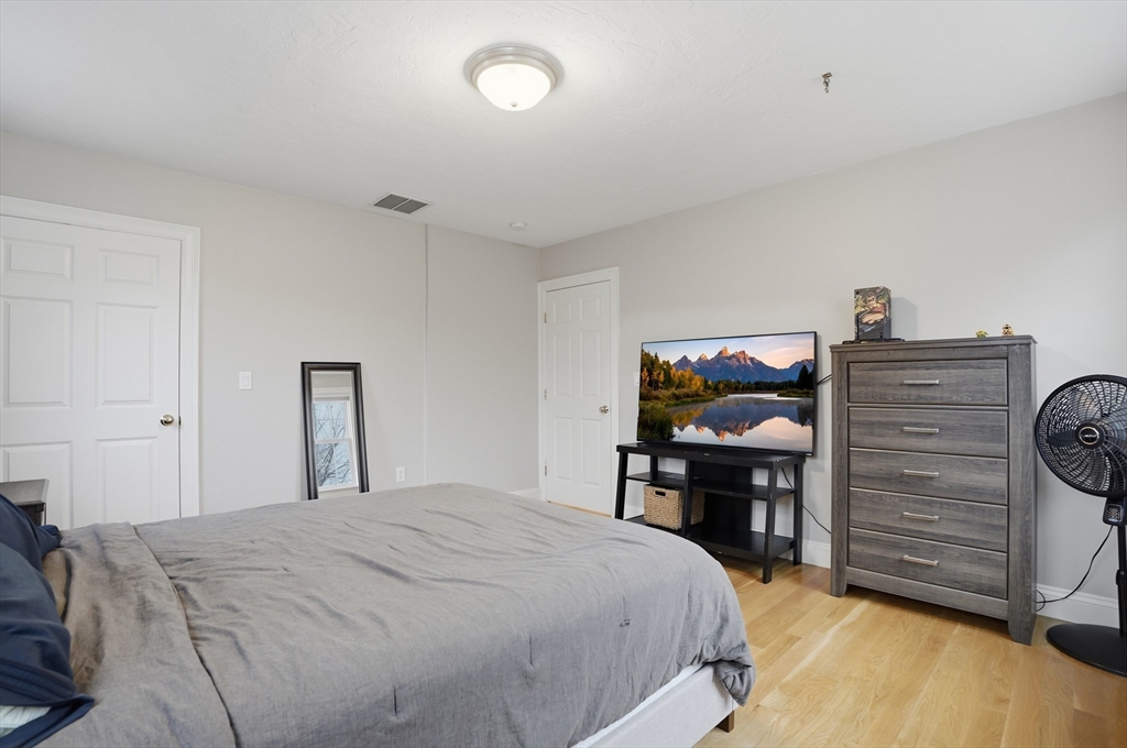 531 Salisbury Street Worcester, MA 01609 - Photo 28 of 42 a bedroom with a bed and a table