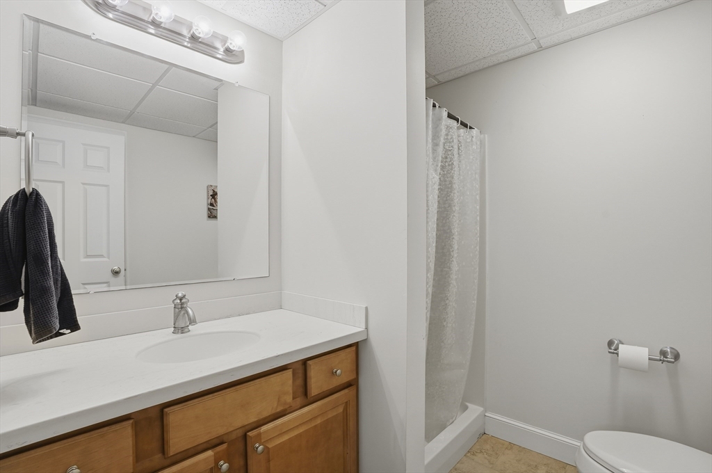 531 Salisbury Street Worcester, MA 01609 - Photo 37 of 42 a bathroom with a sink a toilet and a mirror