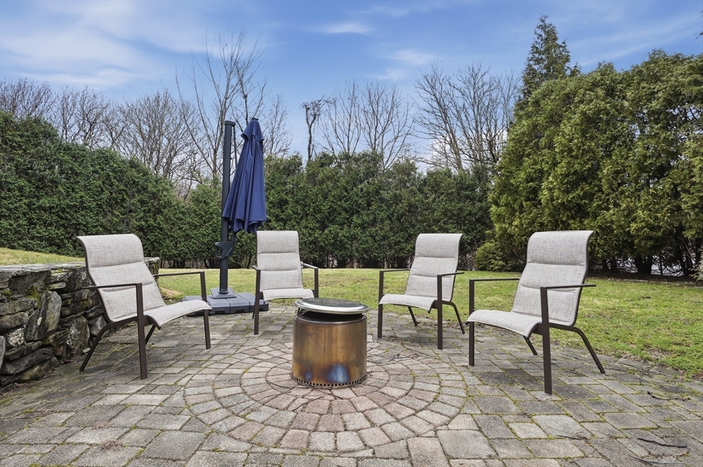531 Salisbury Street Worcester, MA 01609 - Photo 39 of 42 a view of a patio with table and chairs and potted plants