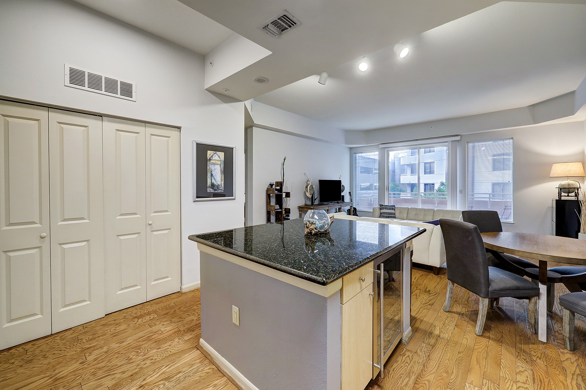 3505 Sage Road, Unit 308 Houston, TX 77056 - Photo 2 of 20 a kitchen view with table chairs and wooden floor