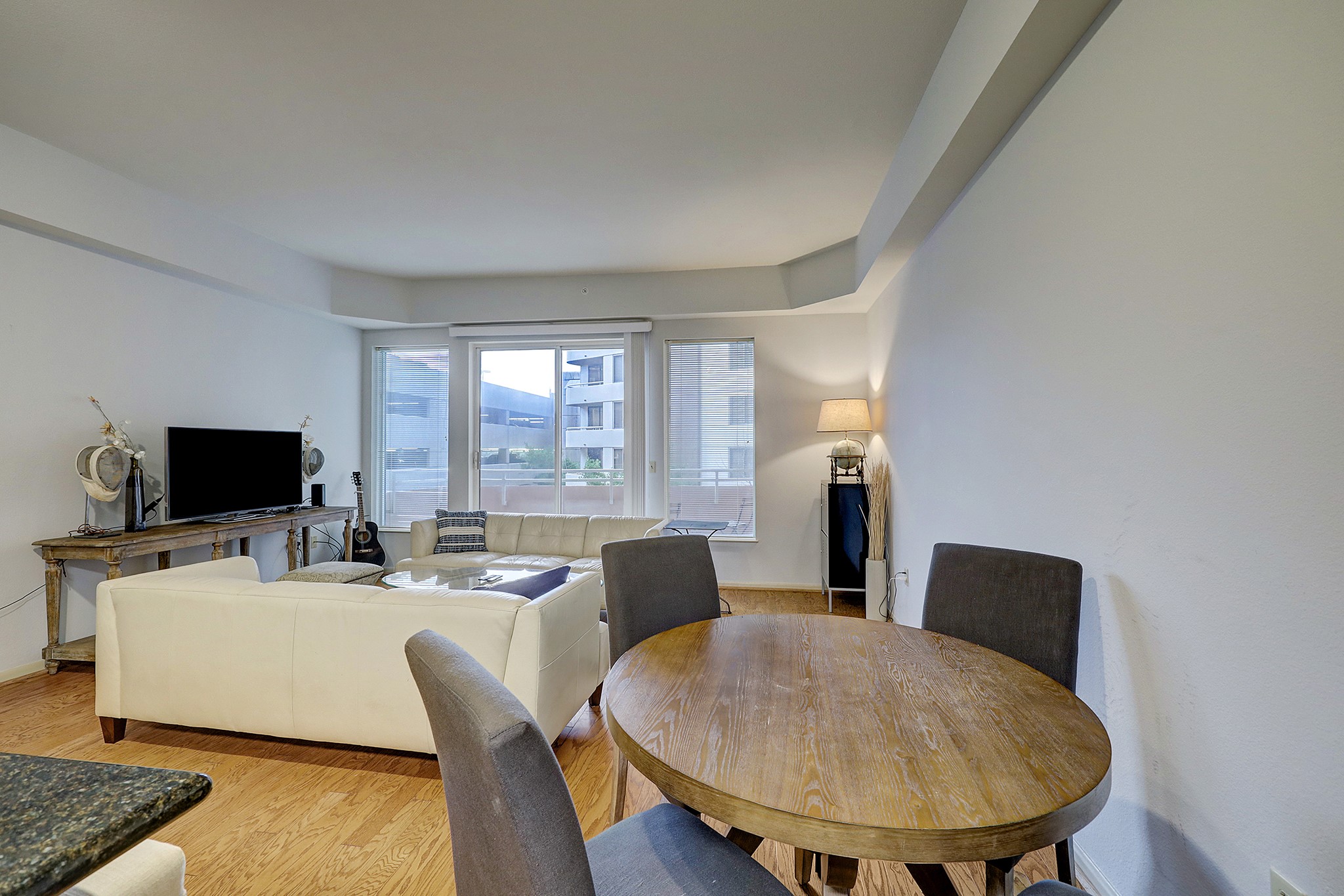 3505 Sage Road, Unit 308 Houston, TX 77056 - Photo 5 of 20 a living room with furniture and a flat screen tv
