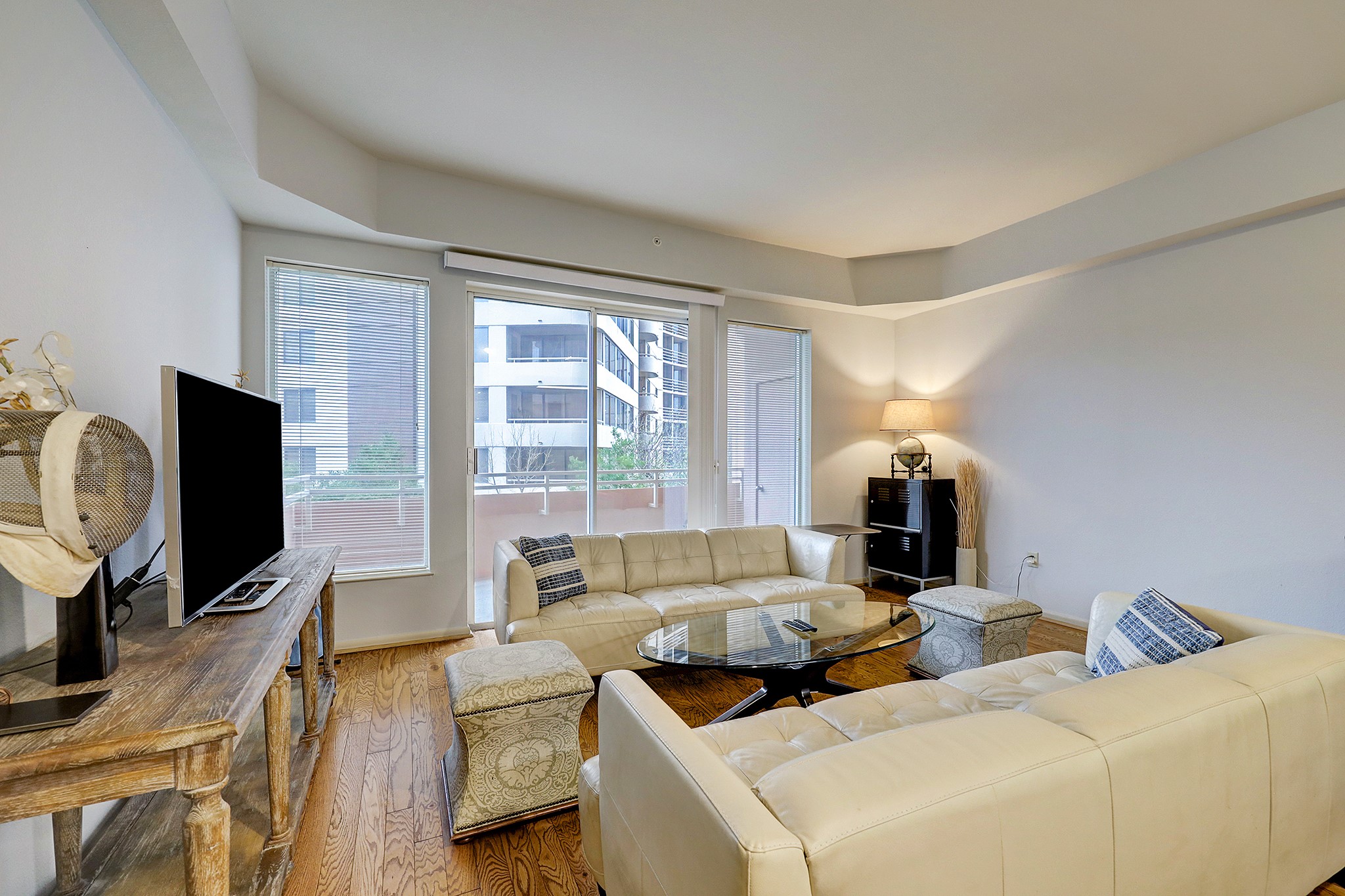 3505 Sage Road, Unit 308 Houston, TX 77056 - Photo 6 of 20 a living room with furniture and a flat screen tv