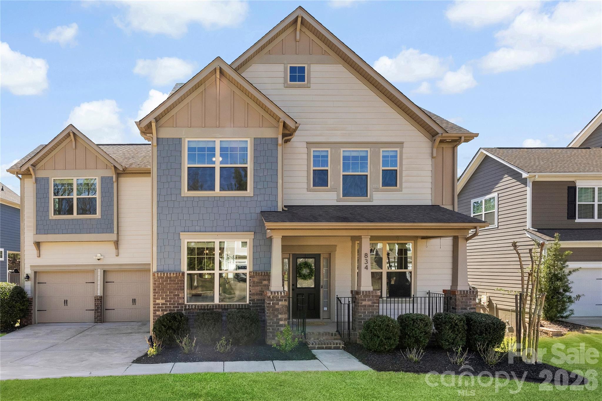 a front view of a house with garden