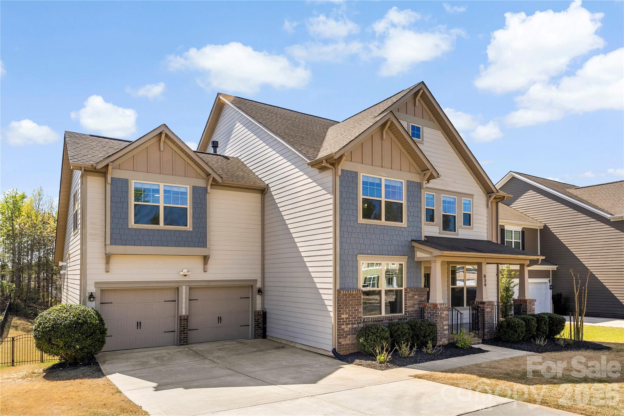 834 Spelman Drive Fort Mill, SC 29707 - Photo 2 of 48 a front view of a house with garden