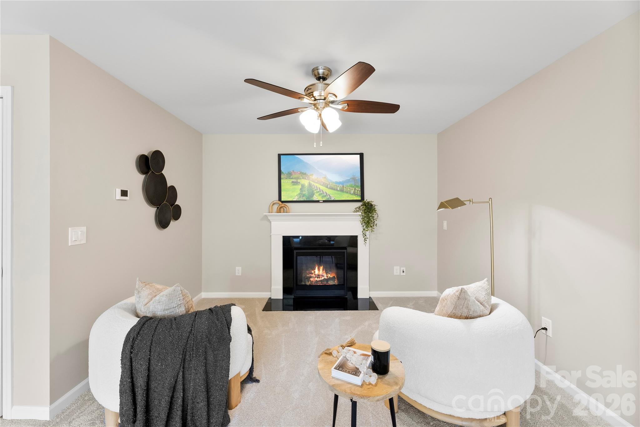 834 Spelman Drive Fort Mill, SC 29707 - Photo 21 of 48 a living room with furniture a fireplace and a large window