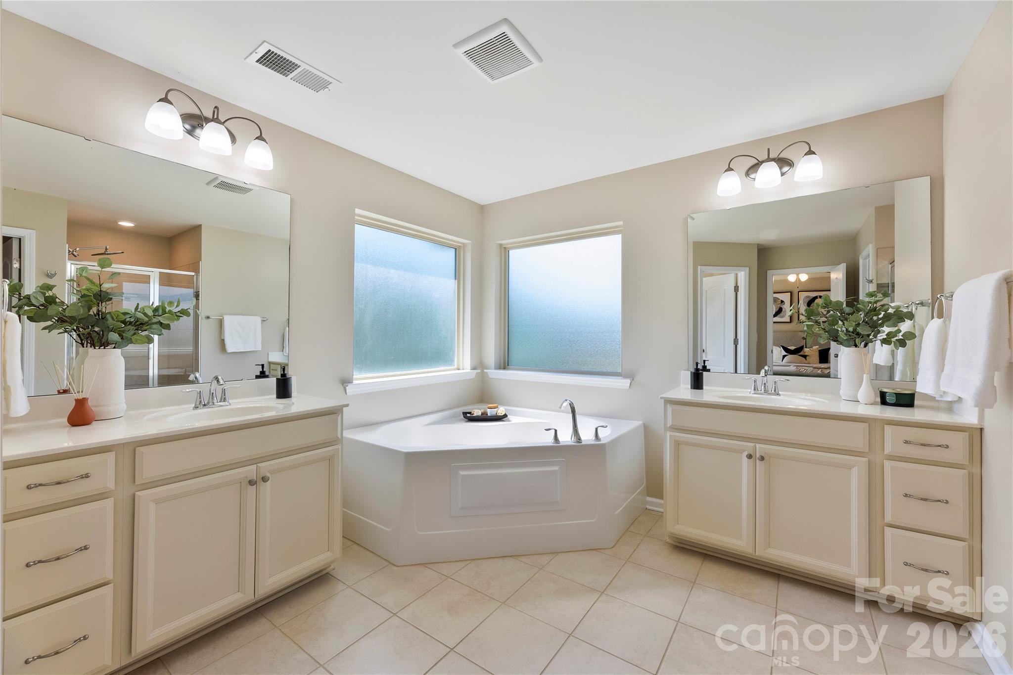 834 Spelman Drive Fort Mill, SC 29707 - Photo 23 of 48 a spacious bathroom with a double vanity sink mirror and bathtub