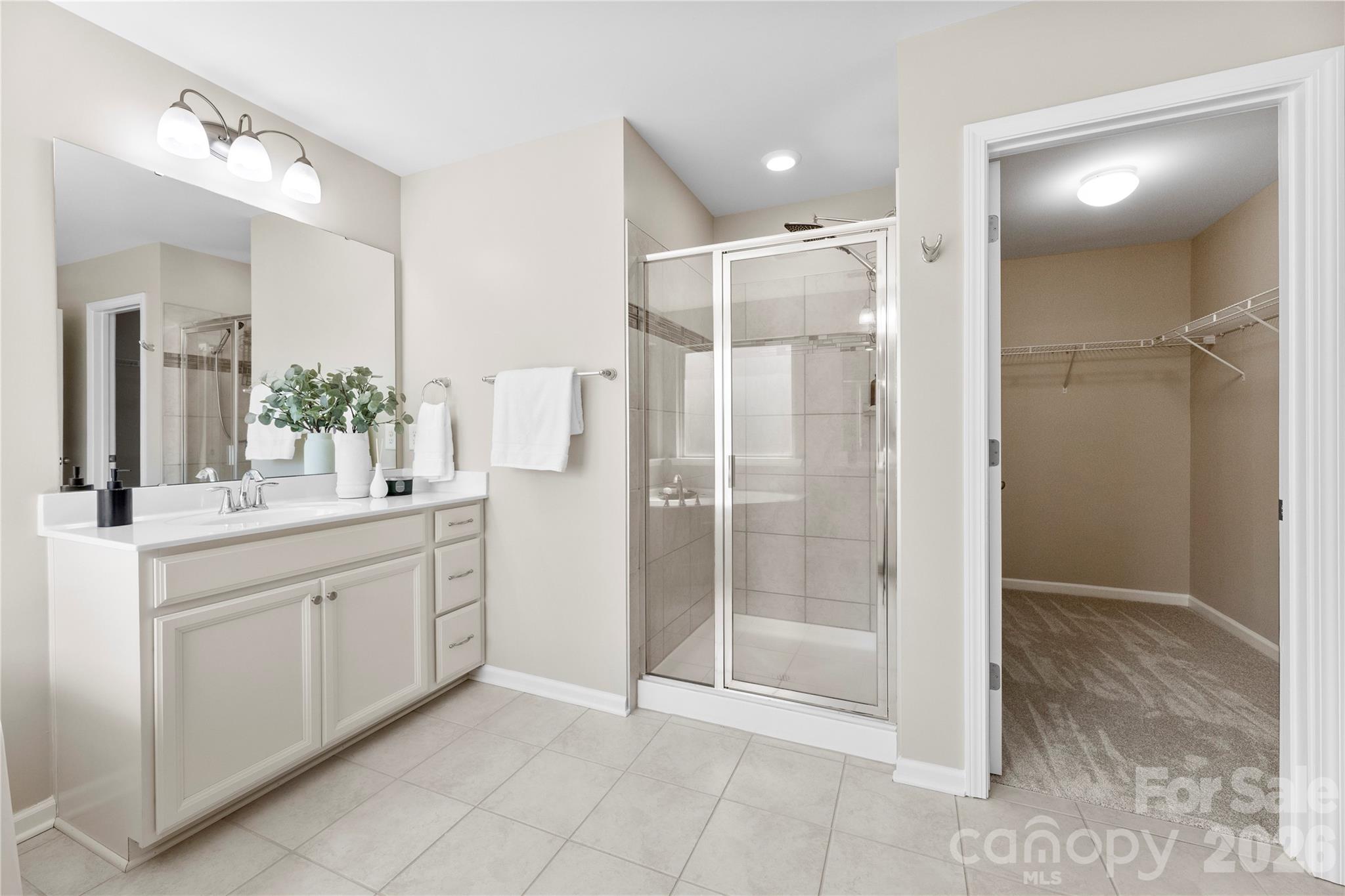 834 Spelman Drive Fort Mill, SC 29707 - Photo 24 of 48 a bathroom with a shower sink and mirror