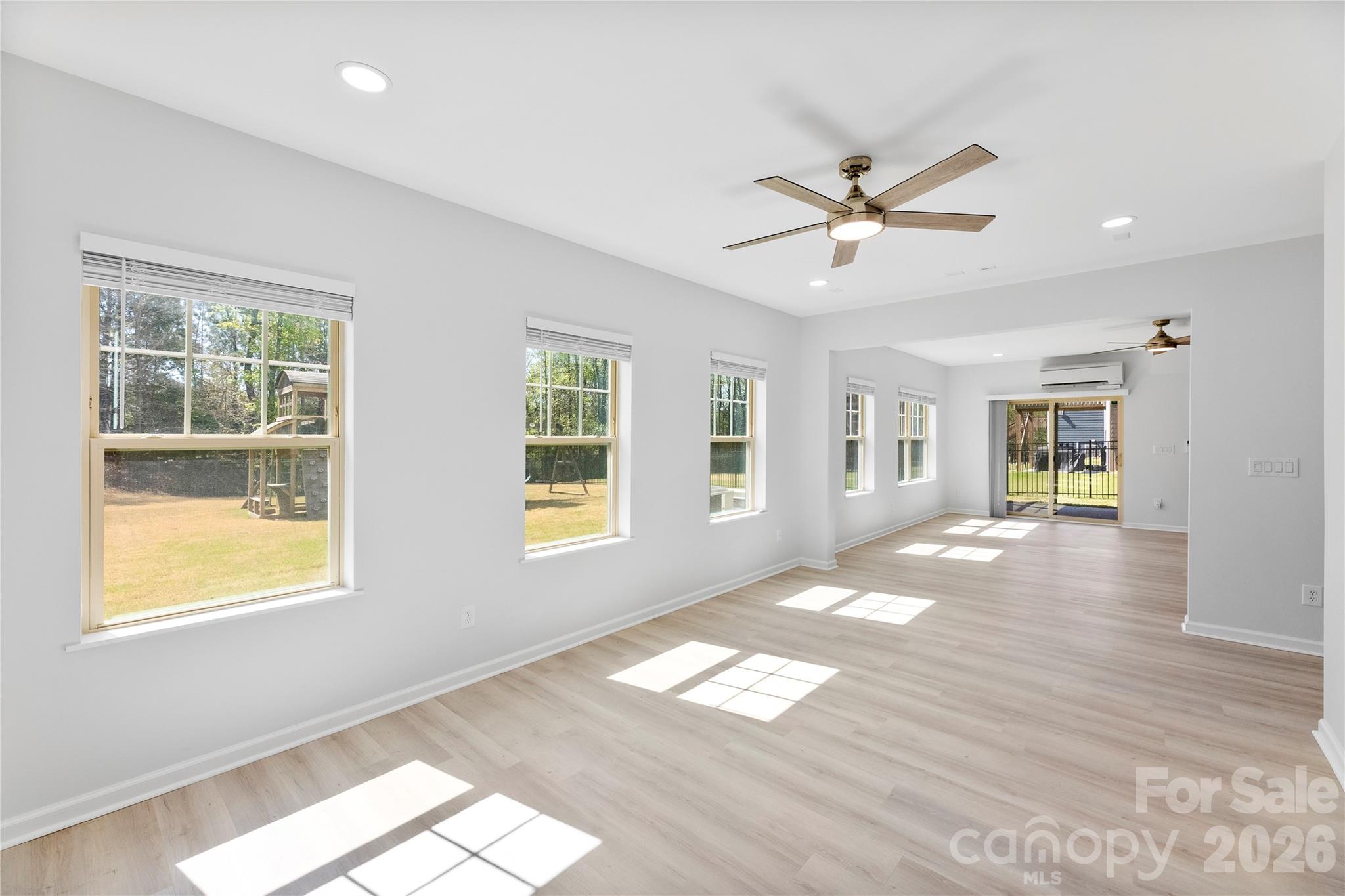 834 Spelman Drive Fort Mill, SC 29707 - Photo 29 of 48 a view of an empty room with a window and wooden floor