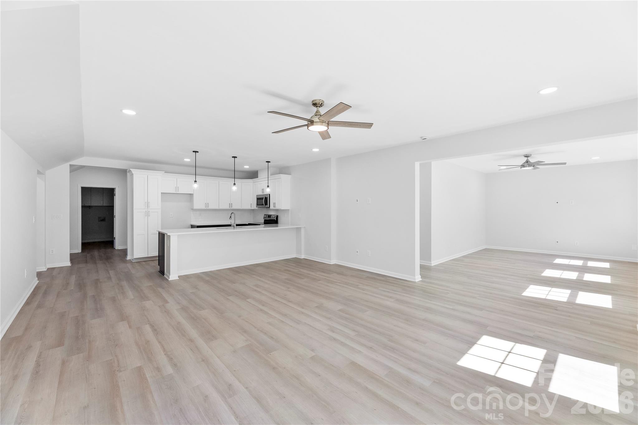 834 Spelman Drive Fort Mill, SC 29707 - Photo 30 of 48 a view of a kitchen with a sink and dishwasher with a white cabinets