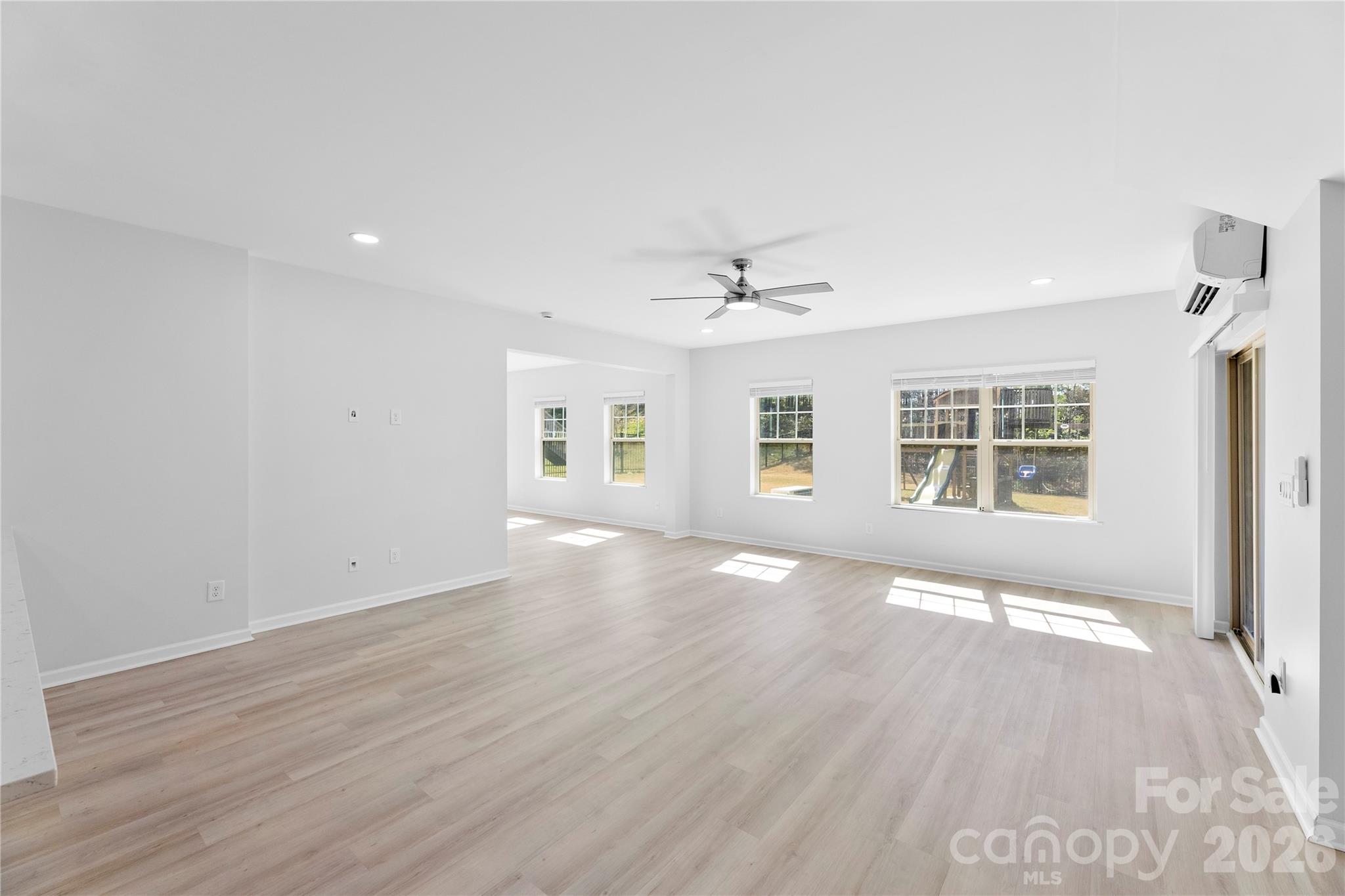 834 Spelman Drive Fort Mill, SC 29707 - Photo 31 of 48 a view of an empty room with wooden floor and a window