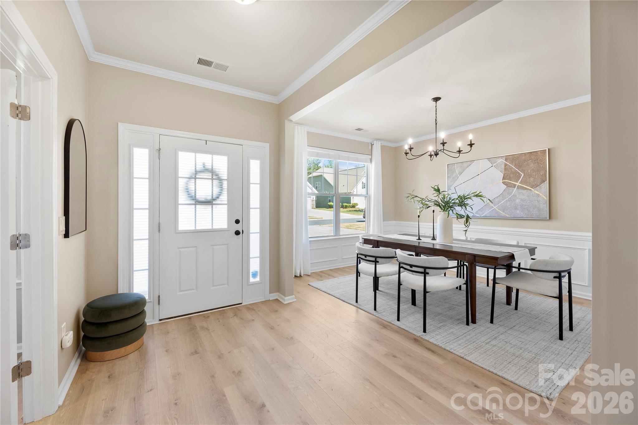 834 Spelman Drive Fort Mill, SC 29707 - Photo 4 of 48 a view of a a dining room with furniture window and wooden floor
