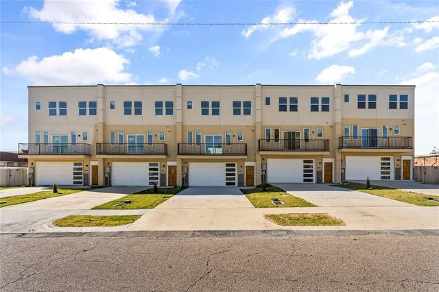 a view of a house with swimming pool and sitting area