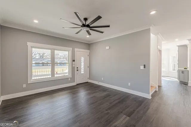a kitchen with stainless steel appliances granite countertop a sink stove and wooden cabinets