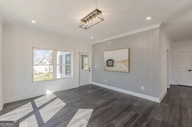 a view of an empty room with a window