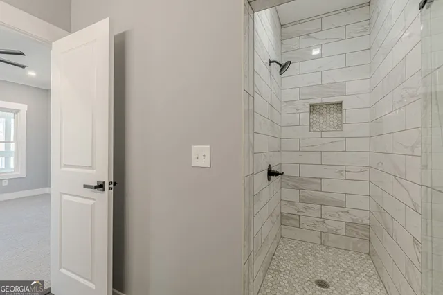 a view of an empty room with a window