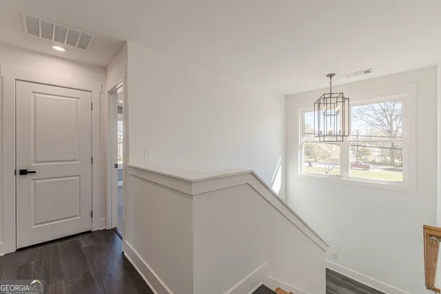 a view of entryway with wooden floor