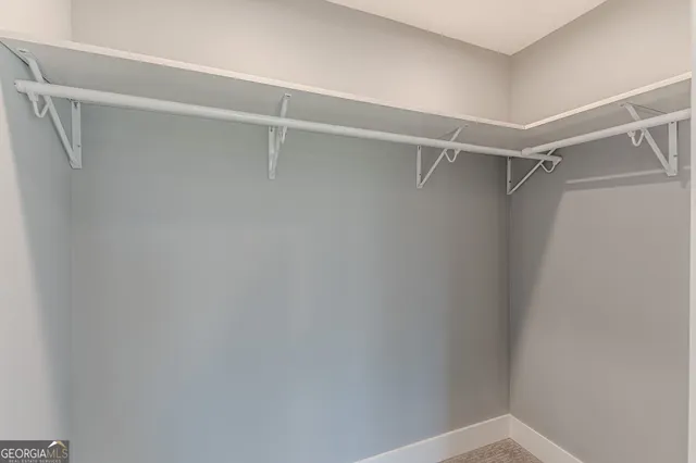 a view of a hallway with seating area