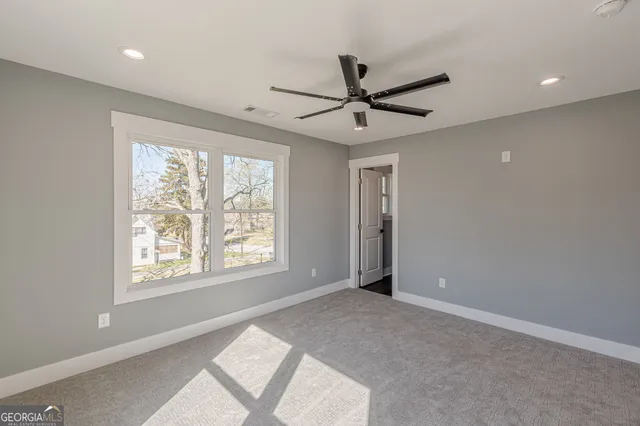 a kitchen with a refrigerator and a sink