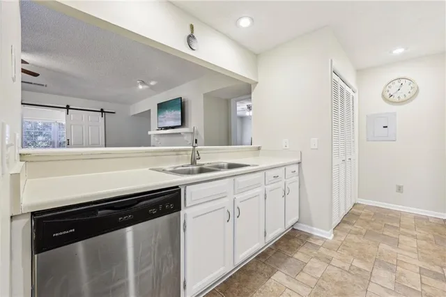 a spacious bathroom with a sink and a mirror