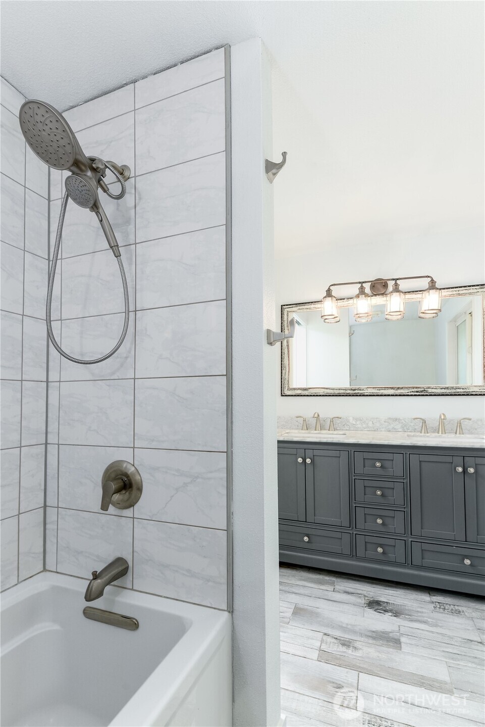 179 Hurricane Ridge Drive Sequim, WA 98382 - Photo 26 of 34 a bathroom with a sink and a mirror