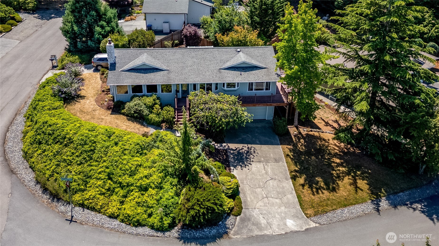 179 Hurricane Ridge Drive Sequim, WA 98382 - Photo 33 of 34 an aerial view of a house with a yard and garden