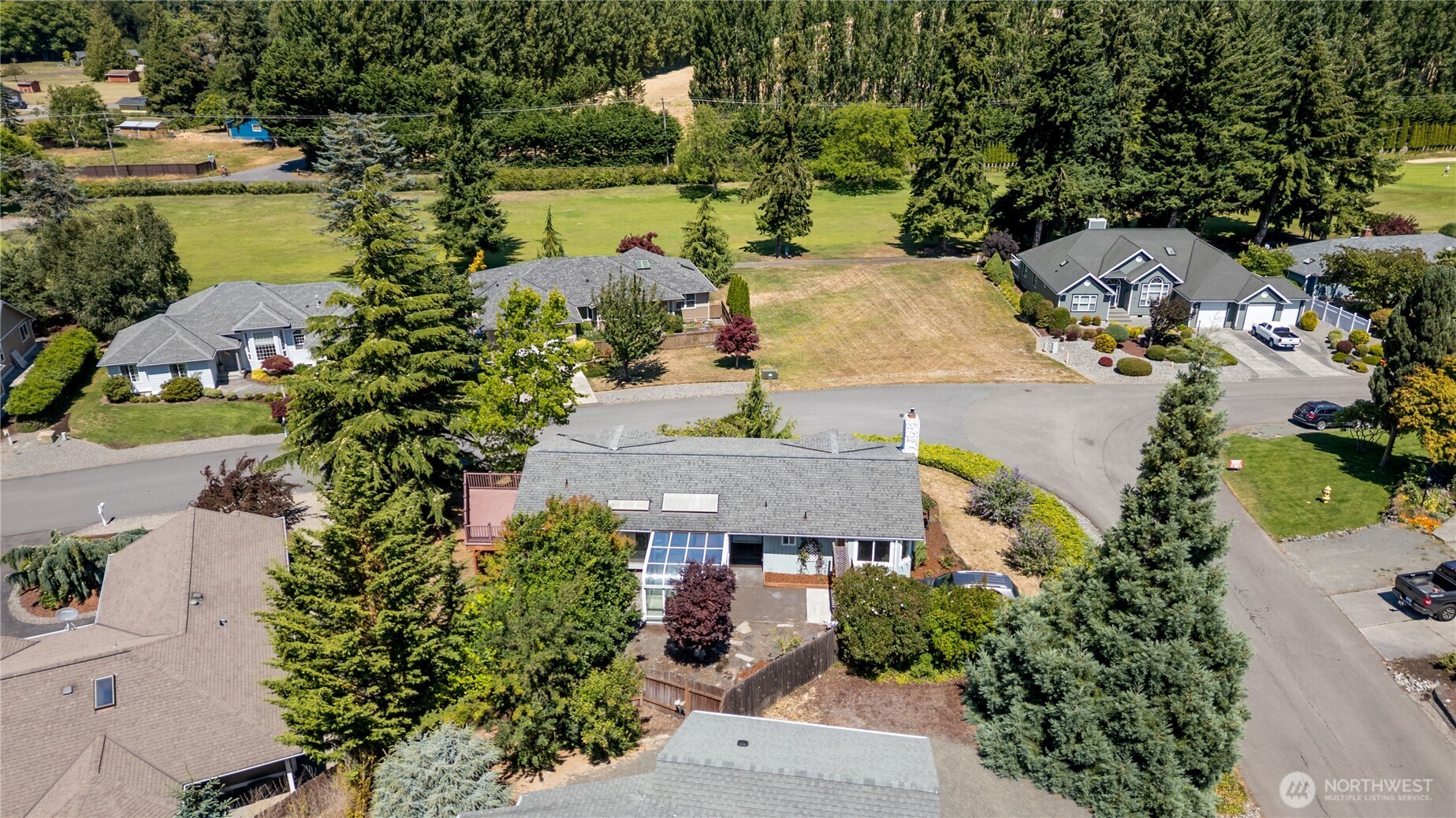 179 Hurricane Ridge Drive Sequim, WA 98382 - Photo 4 of 34 an aerial view of a house with a lake view