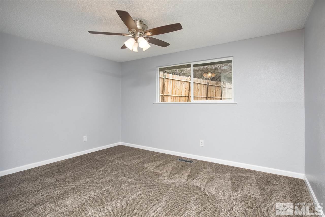 14075 Perlite Drive Reno, NV 89521 - Photo 13 of 25 a view of an empty room with a window
