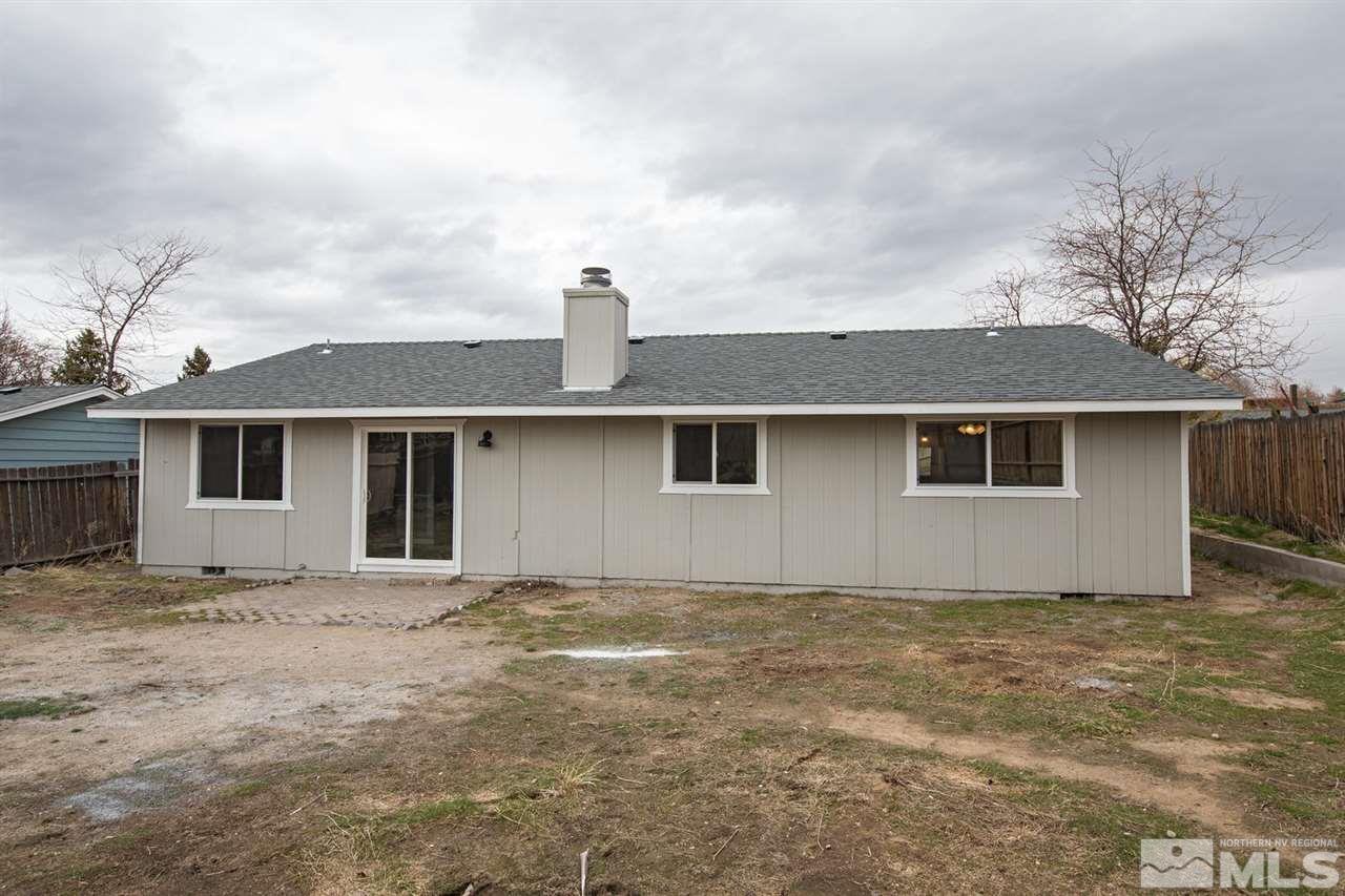 14075 Perlite Drive Reno, NV 89521 - Photo 21 of 25 a house with trees in the background