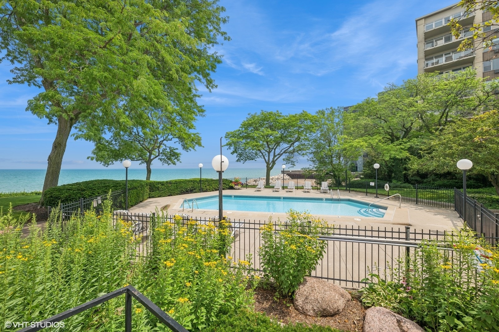 1500 Sheridan Road, Unit 4J Wilmette, IL 60091 - Photo 23 of 24 a view of a swimming pool with a patio and a yard