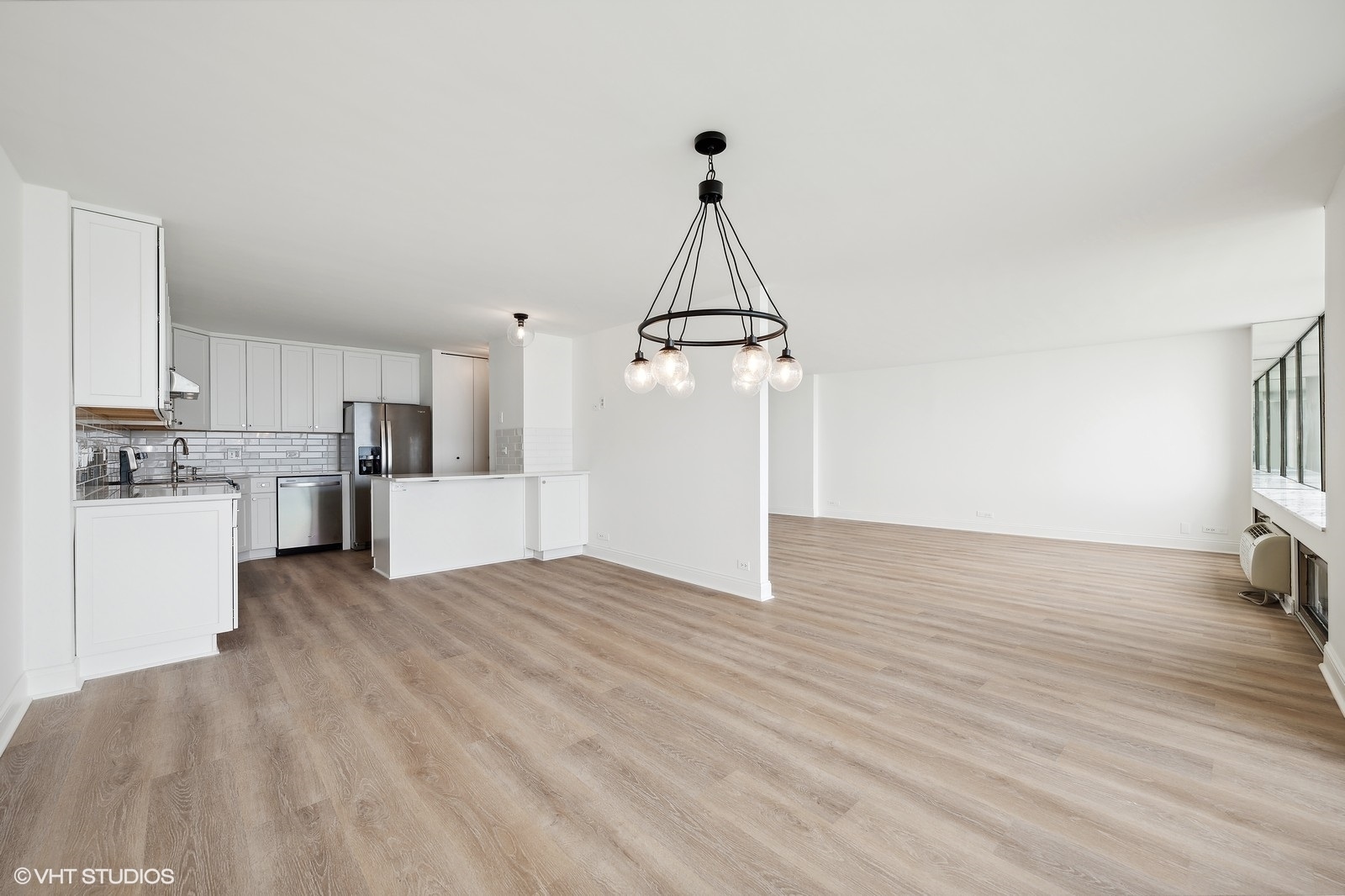 1500 Sheridan Road, Unit 4J Wilmette, IL 60091 - Photo 4 of 24 a view of a kitchen with a sink and dishwasher a refrigerator with wooden floor