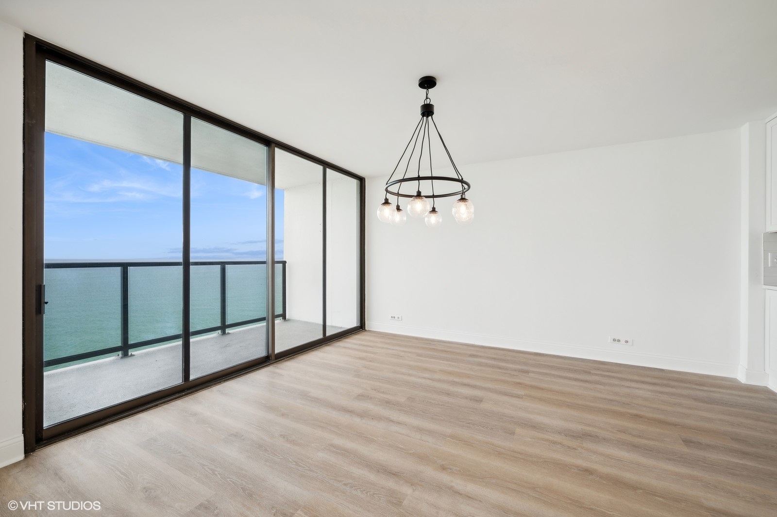 1500 Sheridan Road, Unit 4J Wilmette, IL 60091 - Photo 5 of 24 a view of a room with wooden floor and windows