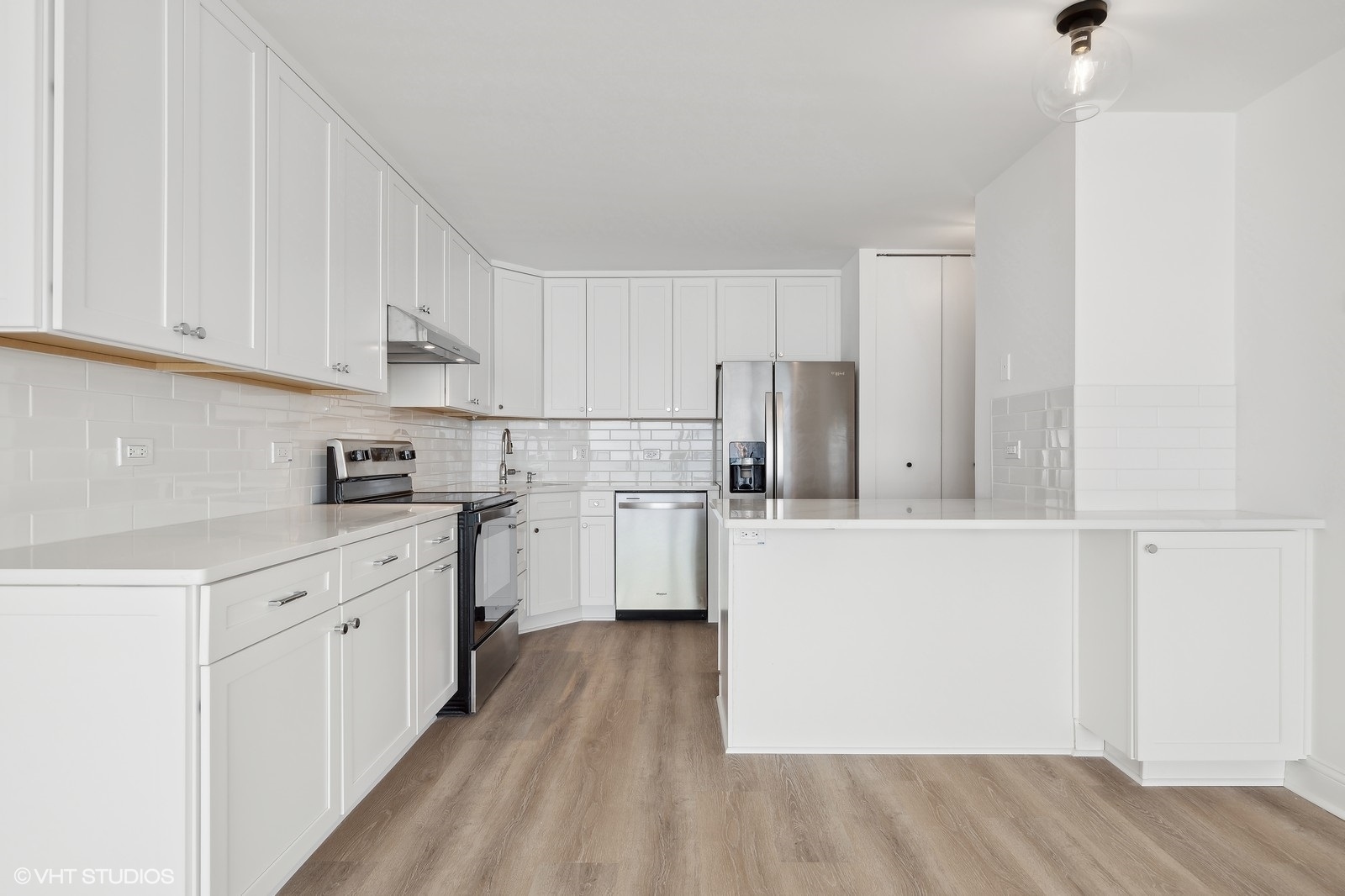 1500 Sheridan Road, Unit 4J Wilmette, IL 60091 - Photo 7 of 24 a kitchen with white cabinets and white appliances