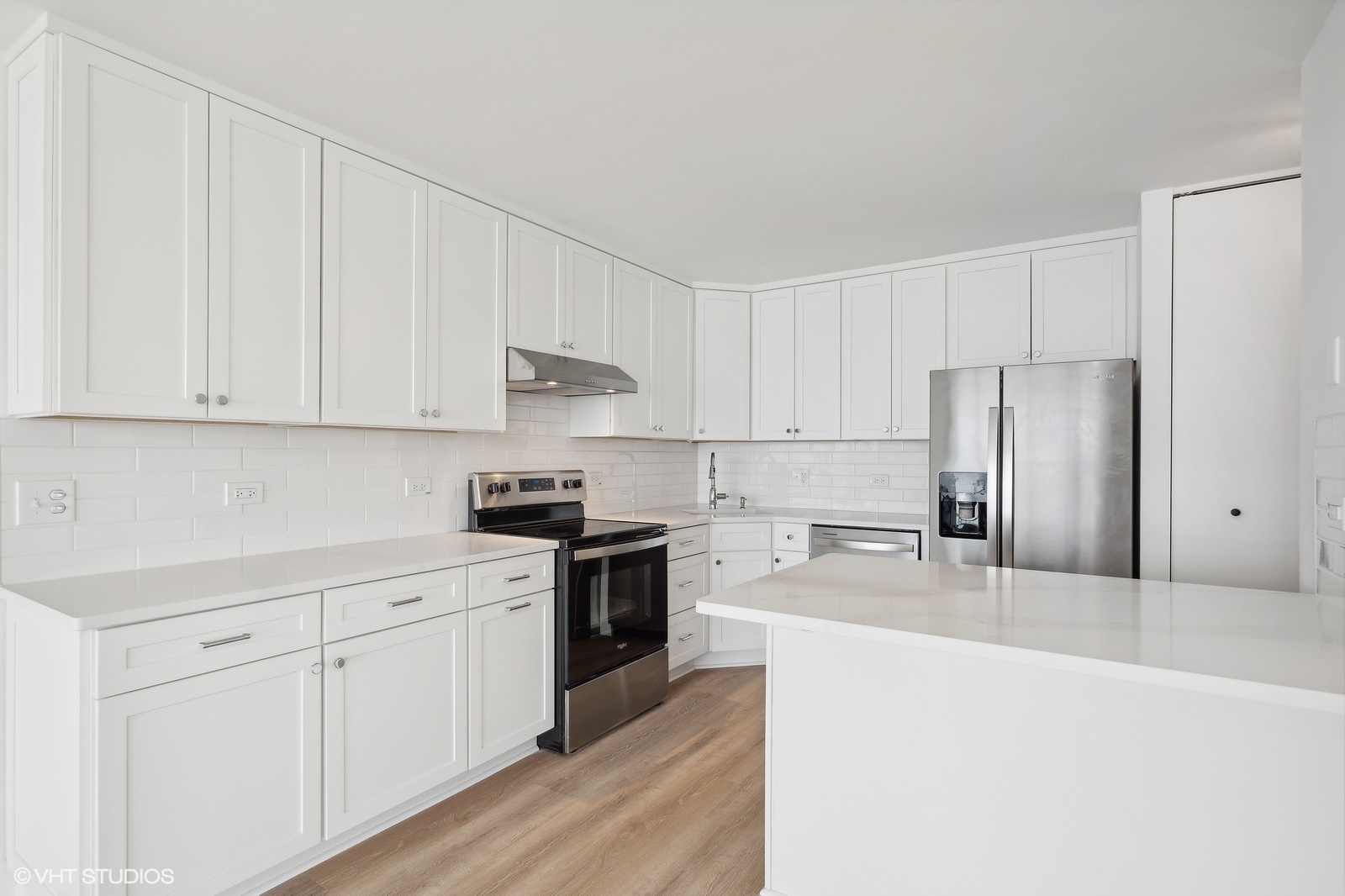 1500 Sheridan Road, Unit 4J Wilmette, IL 60091 - Photo 8 of 24 a kitchen with cabinets appliances a sink and a counter top